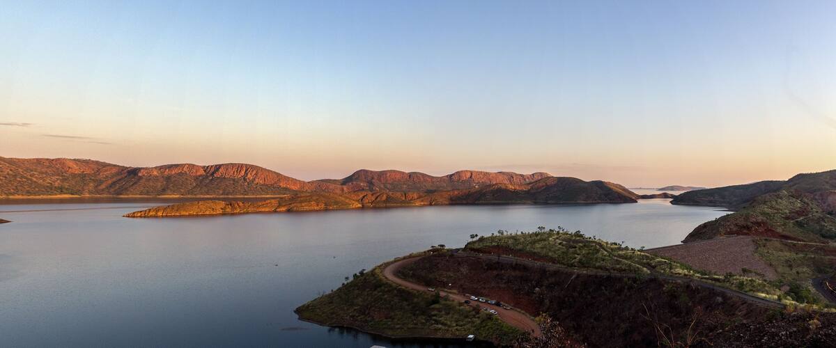 A large body of water surrounded by mountains.