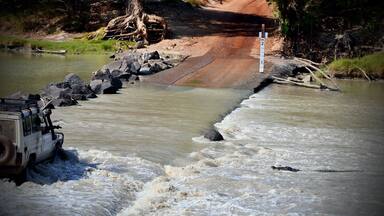 Some big lizards frequent the causeway at Cahill's Crossing near Ubirr in the Northern Territory. Many people have gotten into trouble and had their vehicles swept off the causeway and into the East Alligator River. This 5m+ saltwater crocodile is just one of several hundred who live within a few hundred metres of the causeway. Be safe. Only cross at low tide.