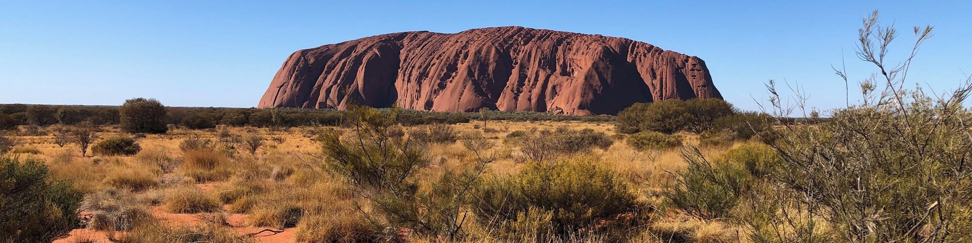 Uluru, in the middle of Australia. Impressive, especially as you get closer. Definitely recommend getting the hats with netting to protect against the flies. #LifeAtExpedia