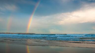 Rainbow over the sea and beach in Pambula - Panorama