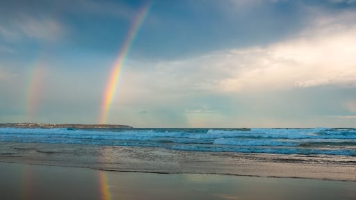 Rainbow over the sea and beach in Pambula - Panorama