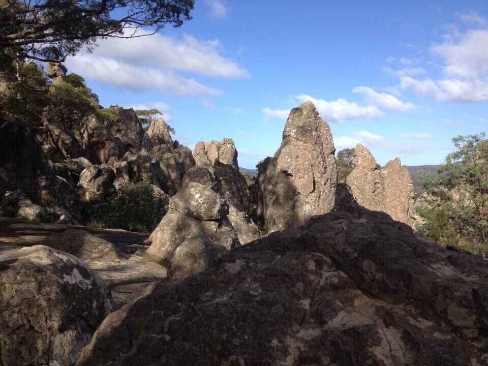 A rocky landscape with prominent rock formations and sparse vegetation.