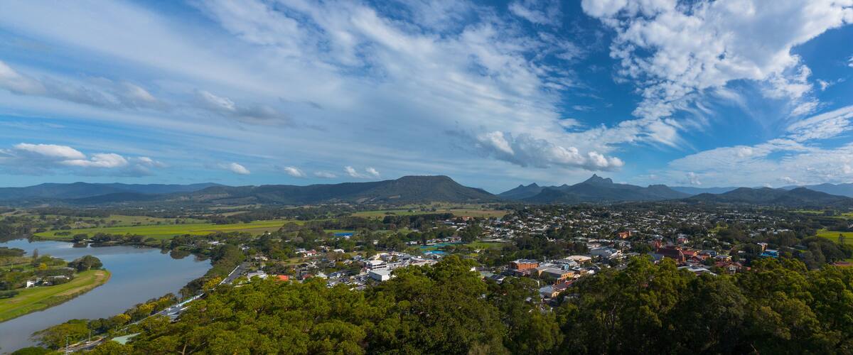 A town nestled between mountains and a river.