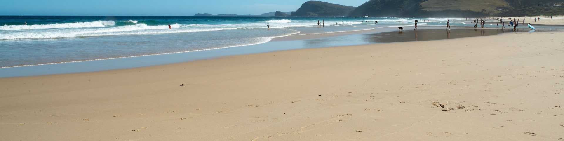 People on a beach at Seal Rocks in Australia
