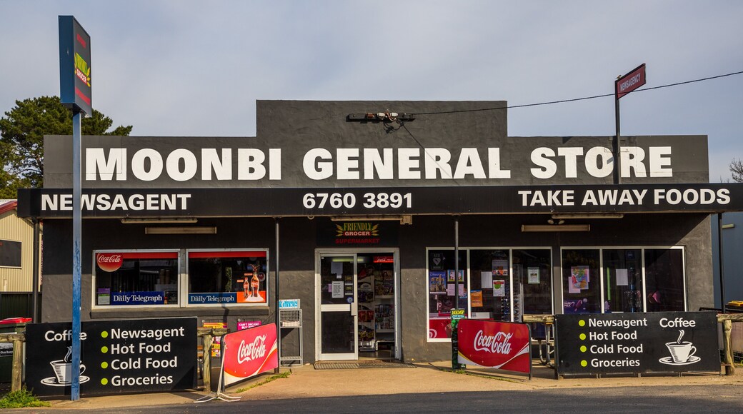 Moonbi featuring signage and a small town or village