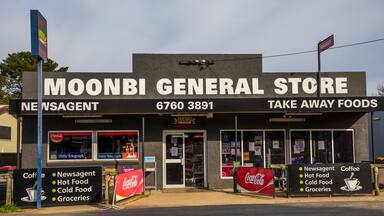 Moonbi featuring signage and a small town or village