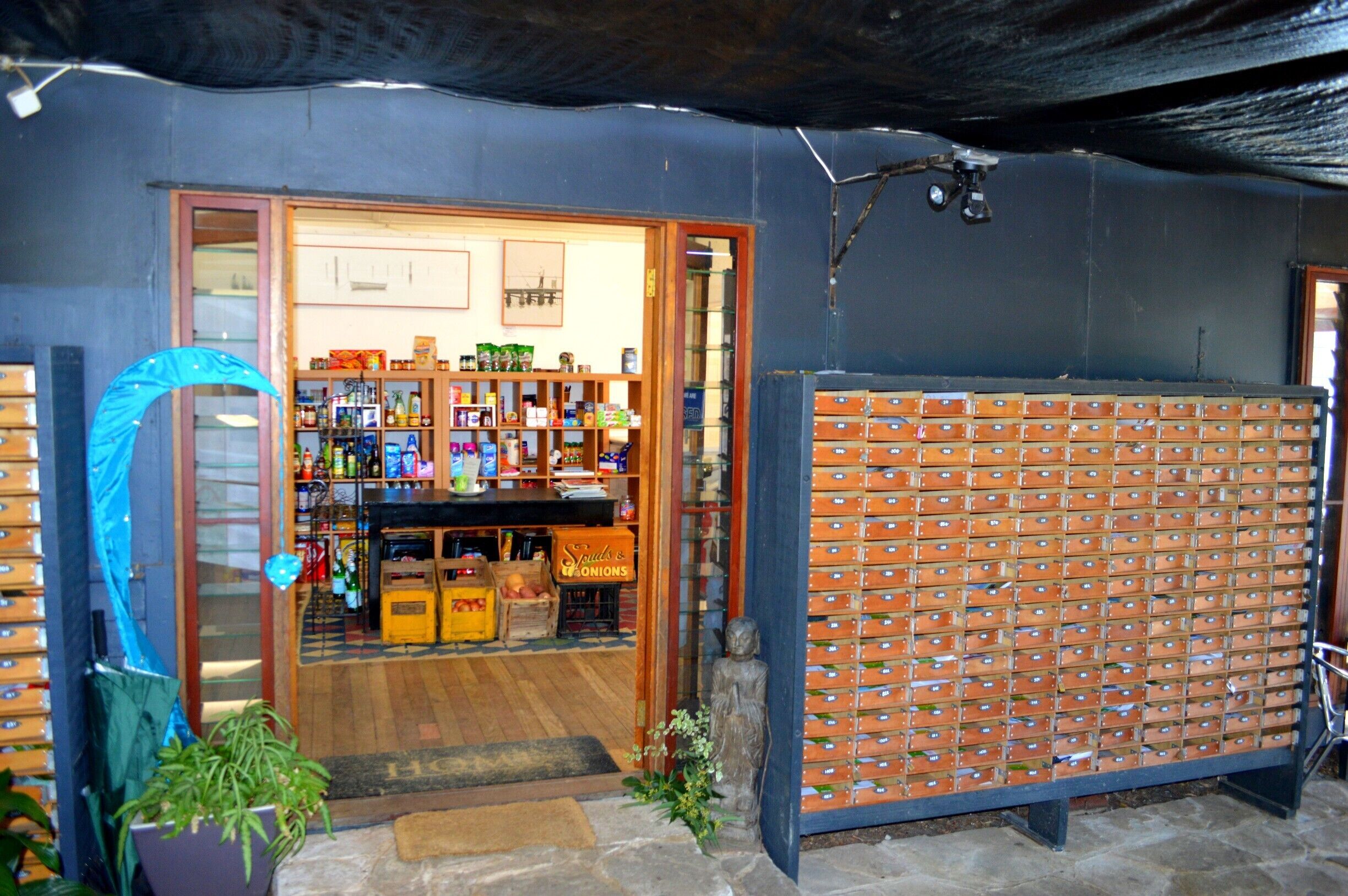 Dangar Island is very Isolated.  But luckily it has its very own Convenience store stocking all the necessary items. it doubles with a delicious cafe within its doors and also holds the mail in these trendy mailboxes outside.  
The locals use wheel burrows to carry their groceries up the hill from the ferry (brought over on the mainland) and their taxi service is a golf buggy.  