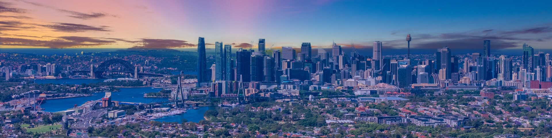 Paisagem urbana com um arranha-céu imponente, um rio e uma área residencial densa.