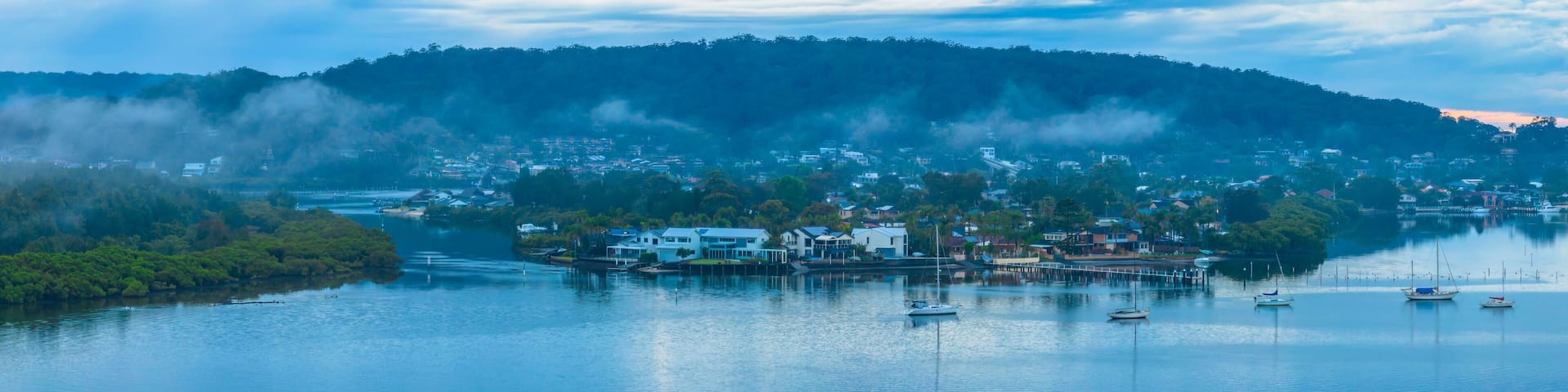 Respite from the rain - Bay waterscape with mountain backdrop