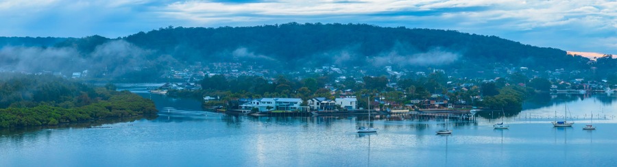 Respite from the rain - Bay waterscape with mountain backdrop