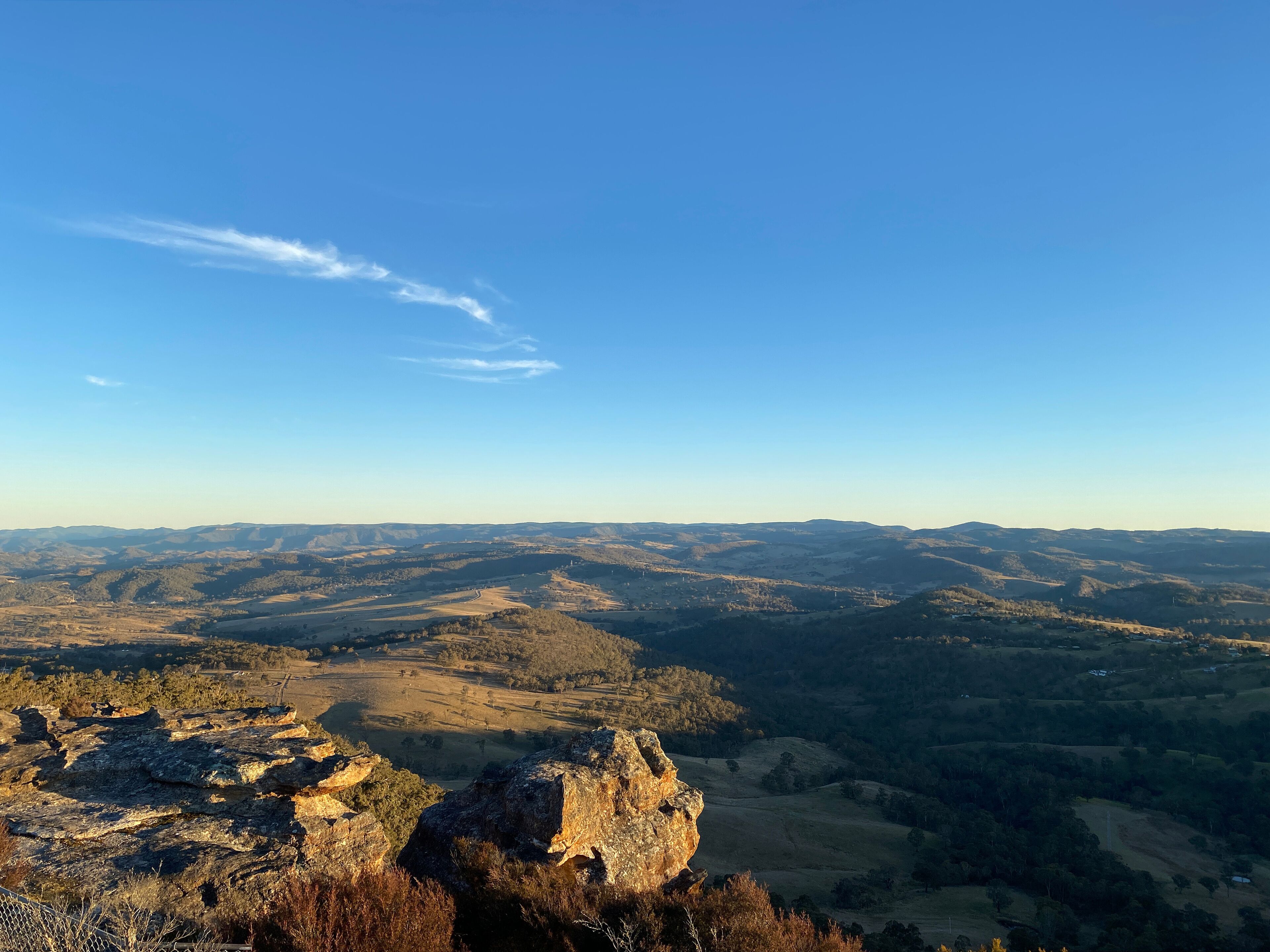 Spectacular views from a mountain-top lookout. Mountains in the horizon. Blue mountains, Australia. Grand canyon sunset. Unusual rock formation. Summit of the mountain.