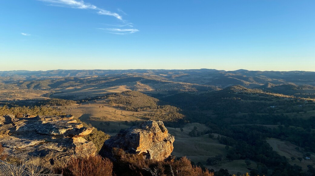 Spectacular views from a mountain-top lookout. Mountains in the horizon. Blue mountains, Australia. Grand canyon sunset. Unusual rock formation. Summit of the mountain.