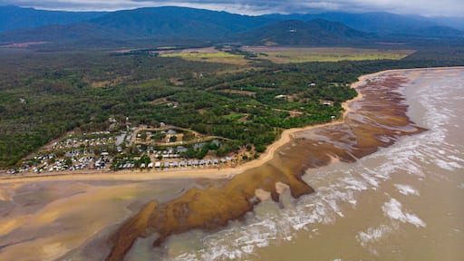 aerial drone panorama of rollingstone creek river mouth in beautiful rural town balgal beach; unique coastline of tropical north queensland near townsville, australia