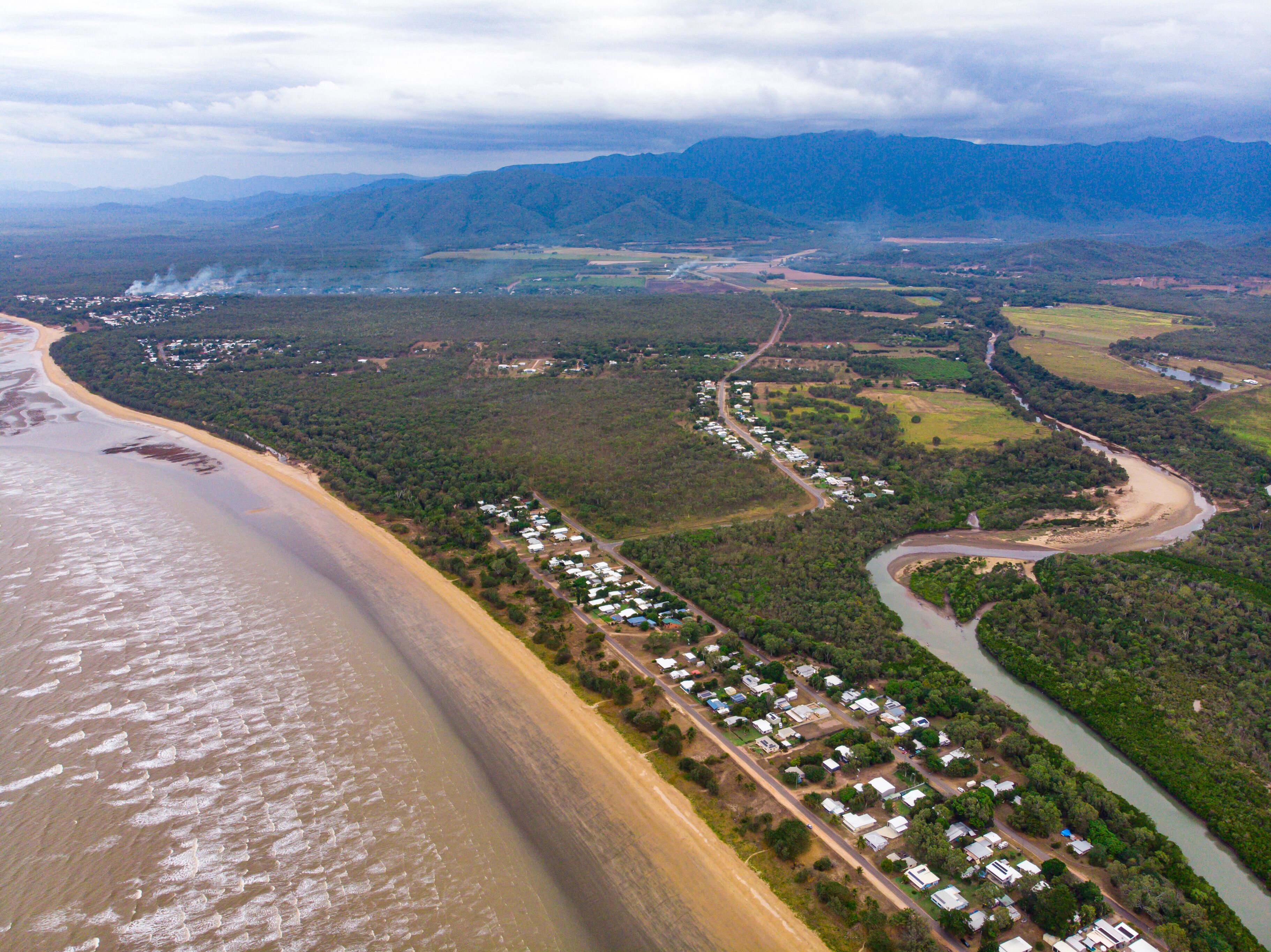 aerial drone panorama of rollingstone creek river mouth in beautiful rural town balgal beach; unique coastline of  tropical north queensland near townsville, australia