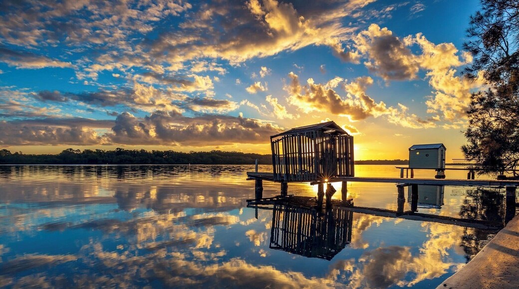 Another shot on the Maroochy river with almost perfect reflection of the clouds framing the little boathouse
