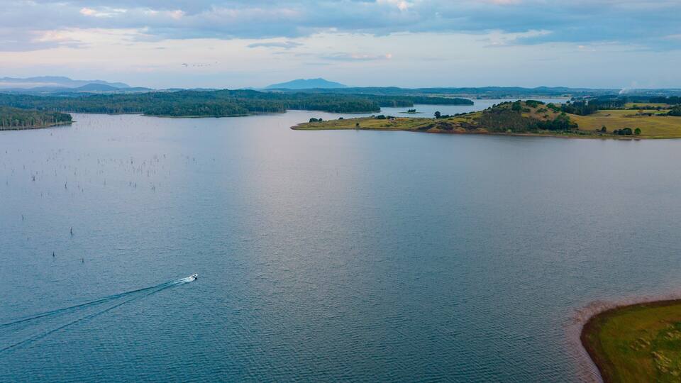 A large lake surrounded by hills and a small island.