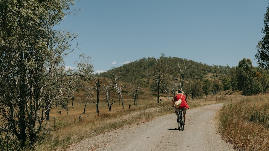 Yimbun showing tranquil scenes and cycling as well as an individual male
