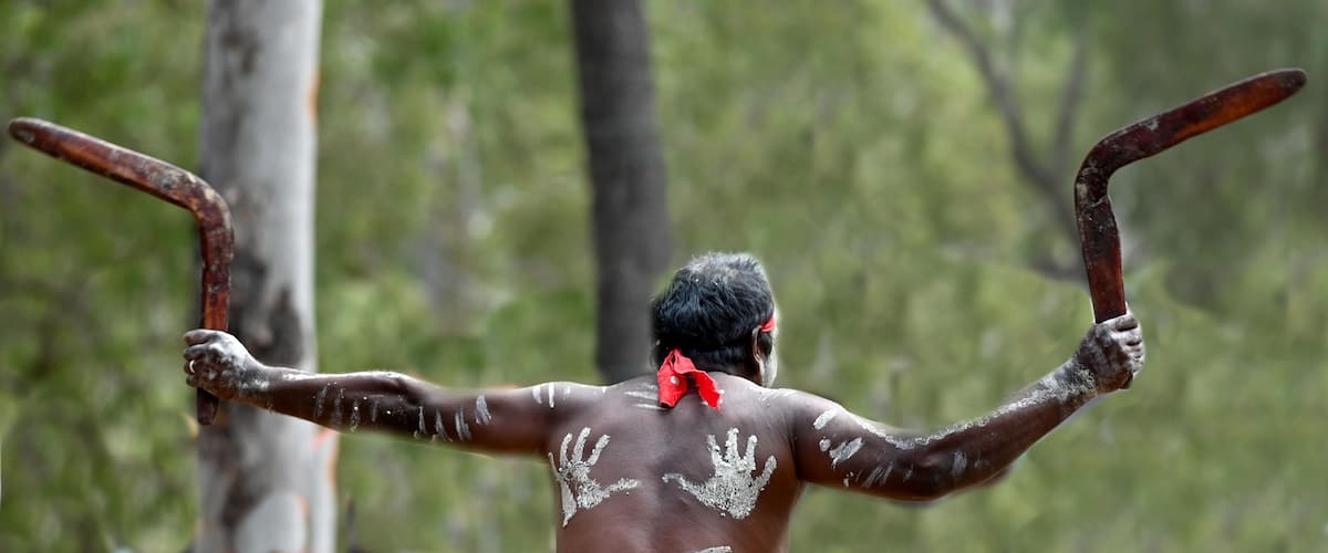 :Indigenous Australians man holding boomerang on ceremonial dance in Laura Festival Cape York Australia