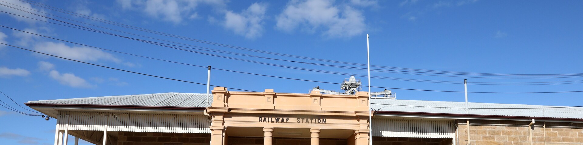 Railway yard and station in the Queensland town of Warwick in Southern Downs Region, featuring buildings, silos and carriages