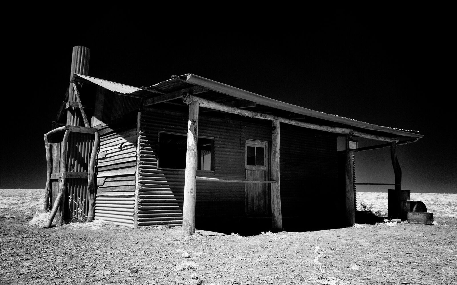 Just before you arrive into Middleton (coming from Winton), keep an eye out to your left for a dirt road and house on your left. 

Remnants of an abandoned movie set makes good pictures