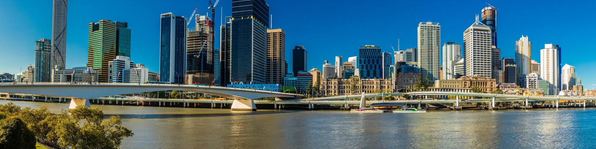 BRISBANE, AUSTRALIA AUG 12 2018: Panoramic view of Brisbane from South Bank over the river.
