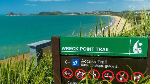 Cooee Bay which includes general coastal views and signage