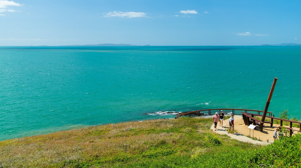 Cooee Bay showing general coastal views as well as a small group of people