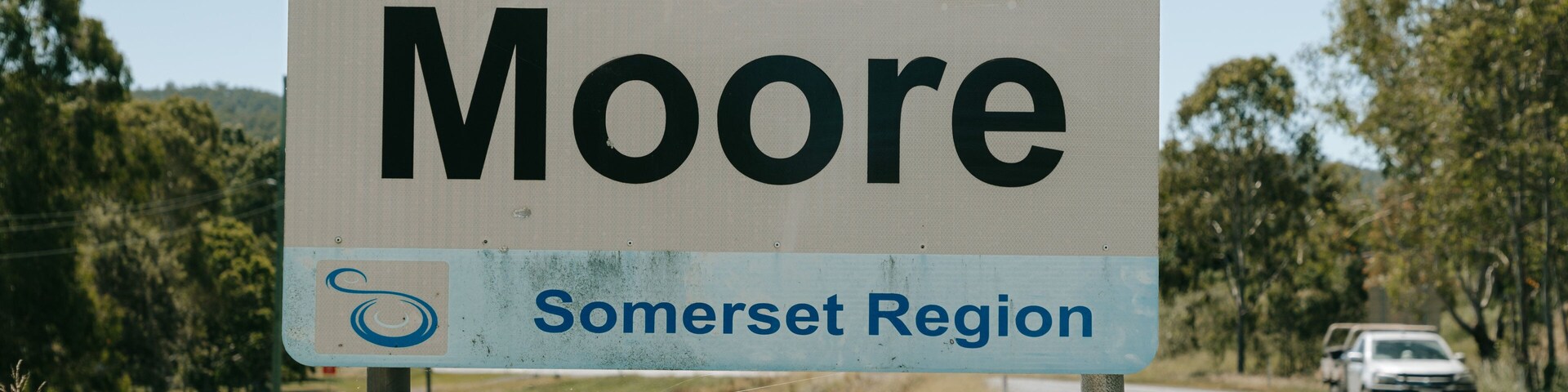 Moore featuring 4 wheel driving, signage and tranquil scenes