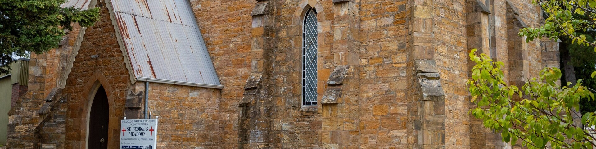 Meadows featuring a church or cathedral and heritage architecture