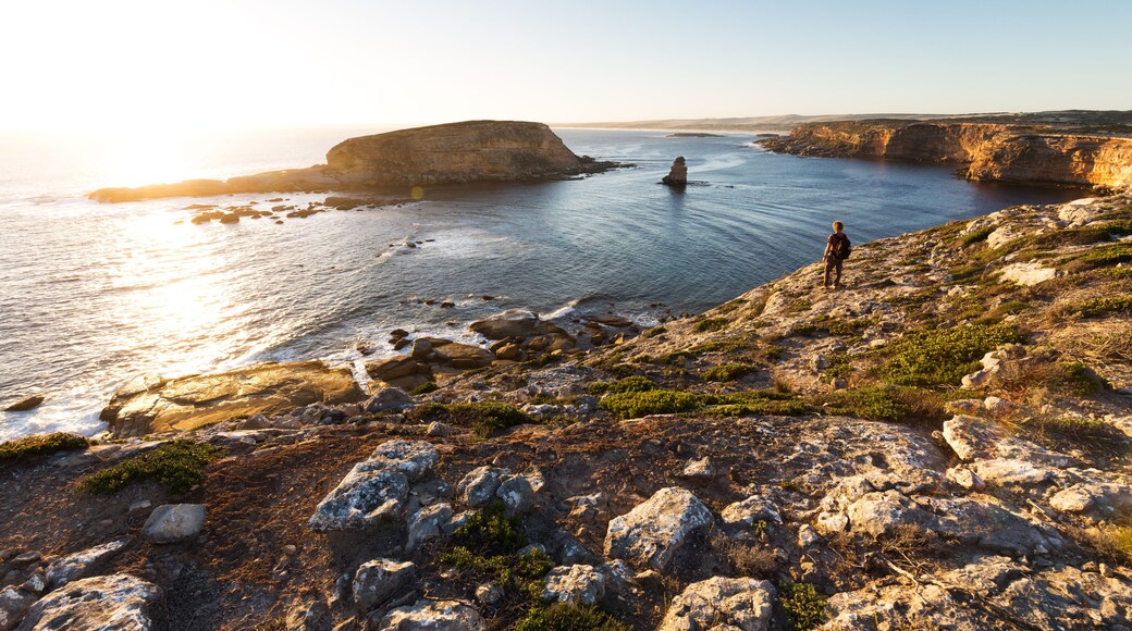 Person looking at beautiful ocean sunset on rugged coastline in South Australia