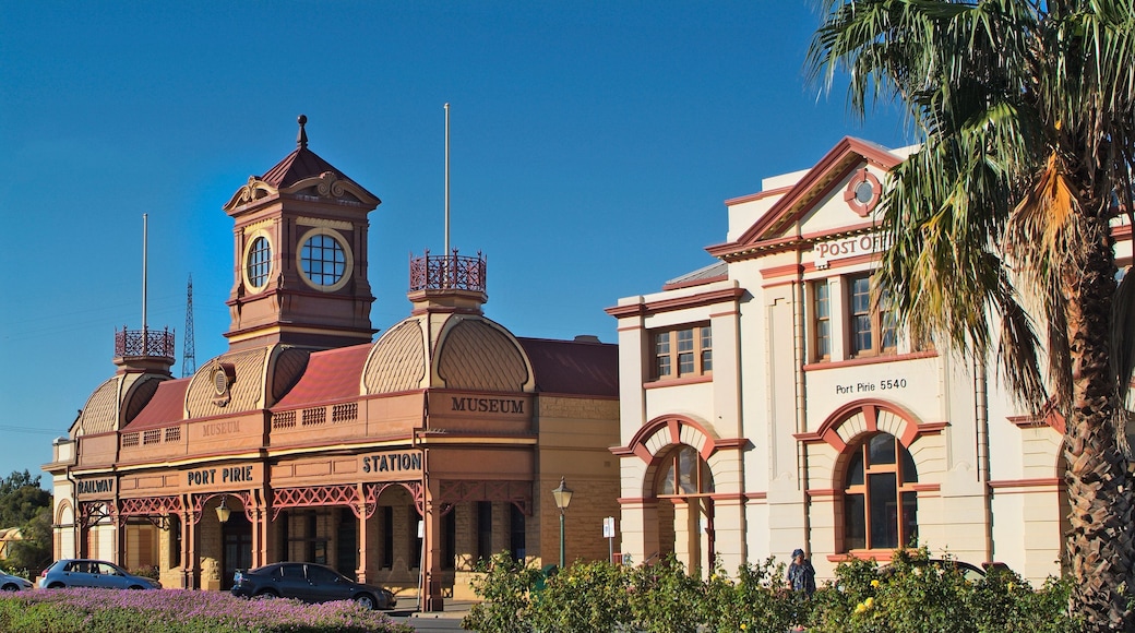 A historic building with a clock tower and a museum sign.