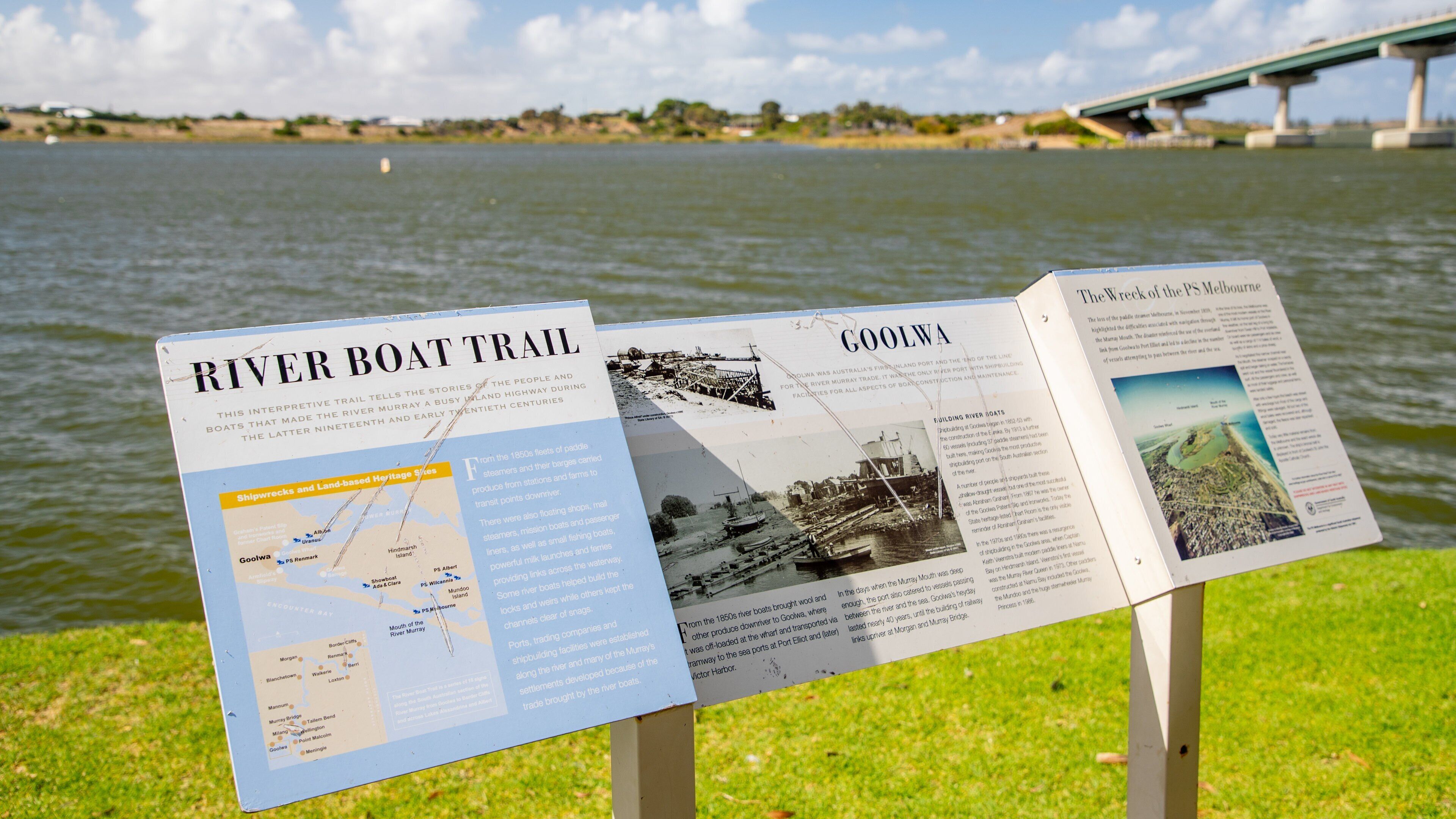 Goolwa Beach which includes a river or creek and signage