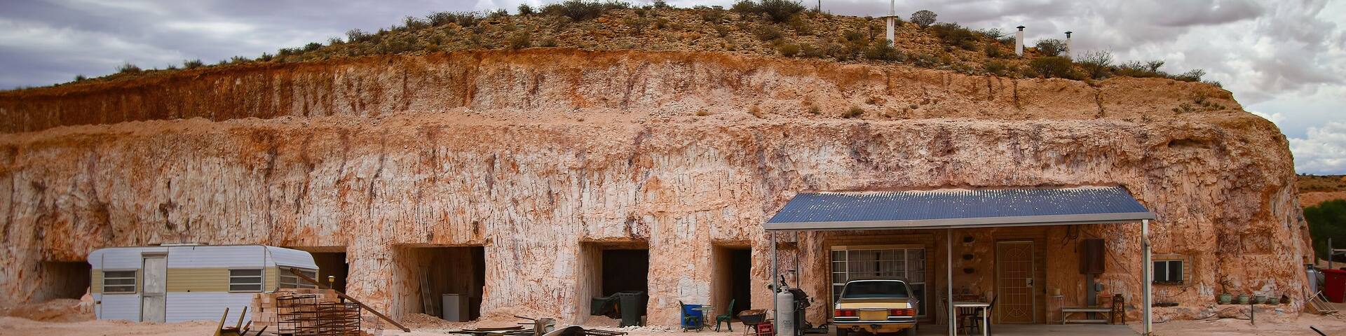 Hillside entrance to a dug out, an underground house in the opal mining town of Coober Pedy in the outback of South Australia
