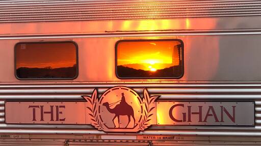 A train with a camel silhouette and the words "THE GHAN" on the side.