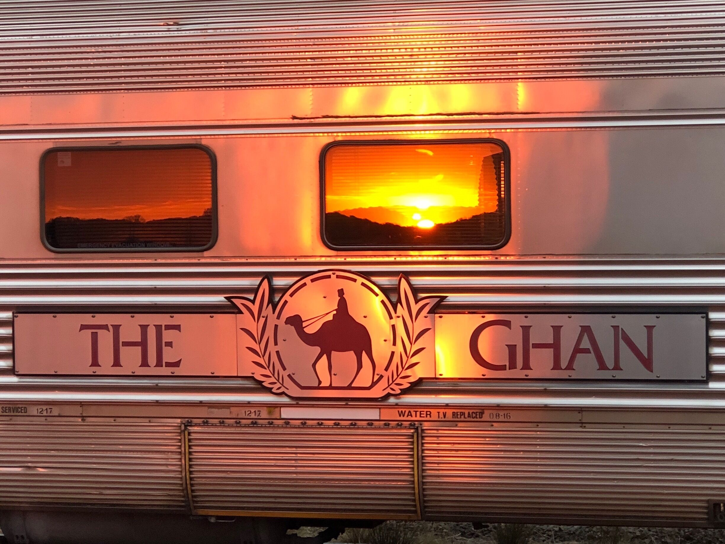 A train with a camel silhouette and the words "THE GHAN" on the side.