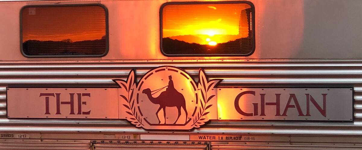 A train with a camel silhouette and the words "THE GHAN" on the side.