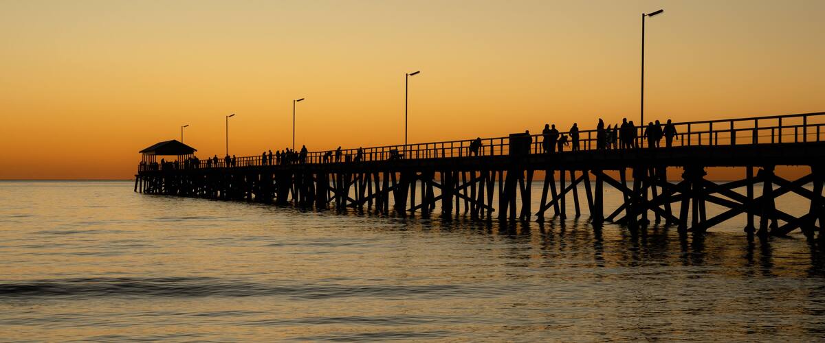 sunset on the beach semaphore jetty in silhouette