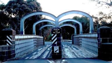 I have no idea why these arches exist over this old bridge. I guess they stop large trucks...