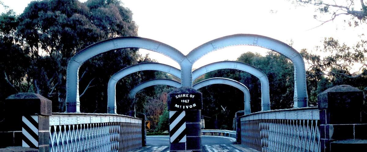 A metal bridge with a 'Keep Left' sign and a 'Shire of 1867 Meivor' sign.