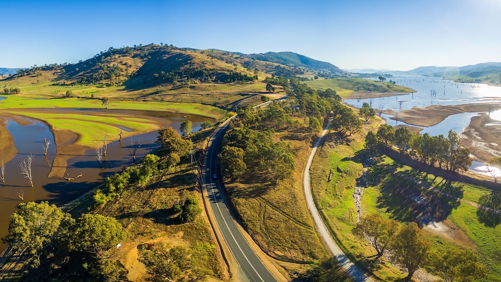 Aerial panorama landscape of Murray Valley Highway and bridge over Lake Hume on bright sunny day. Victoria, Australia