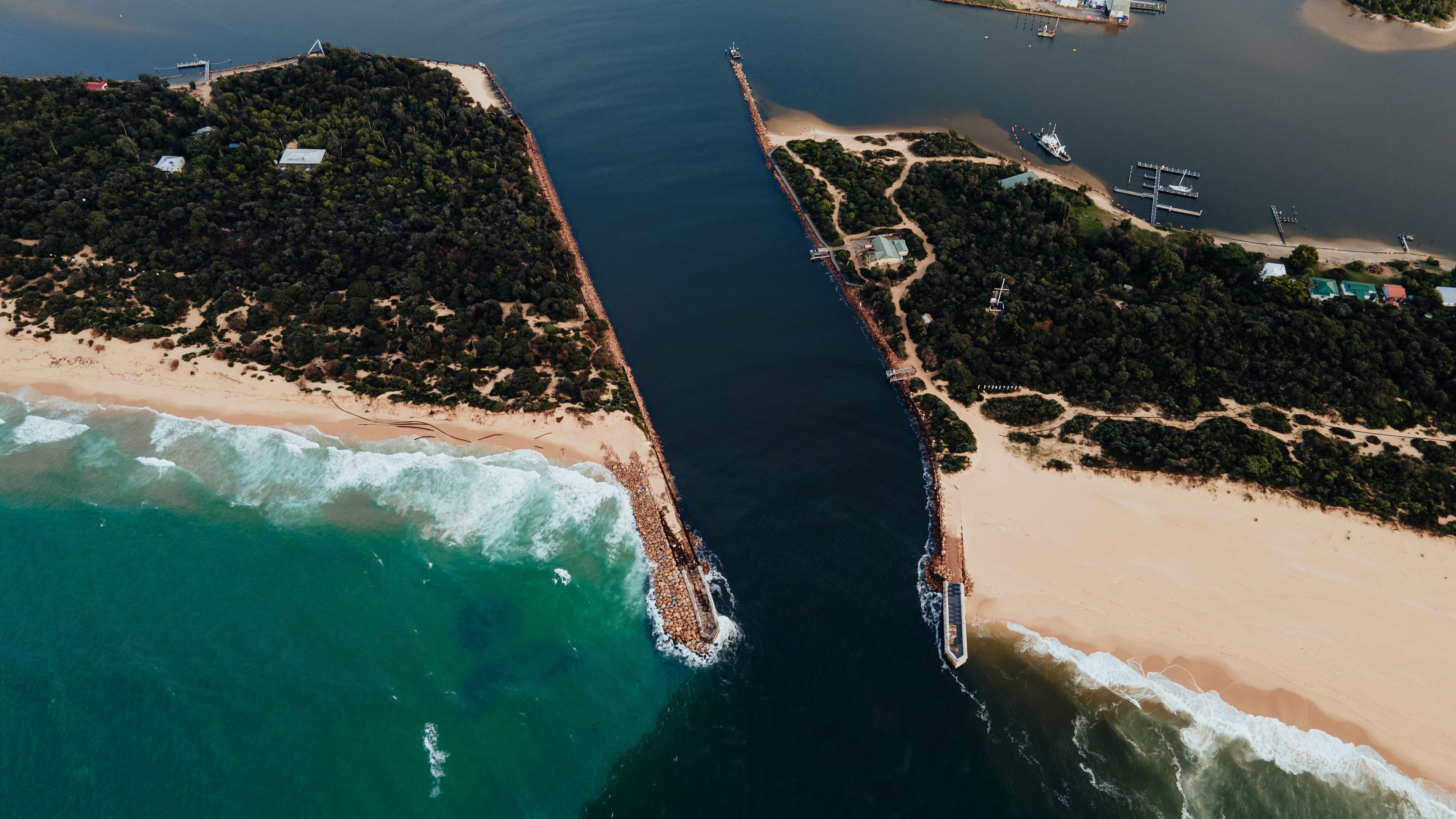 The Entrance at Lakes Entrance Victoria Australia showing warning signs in the channel for boating 