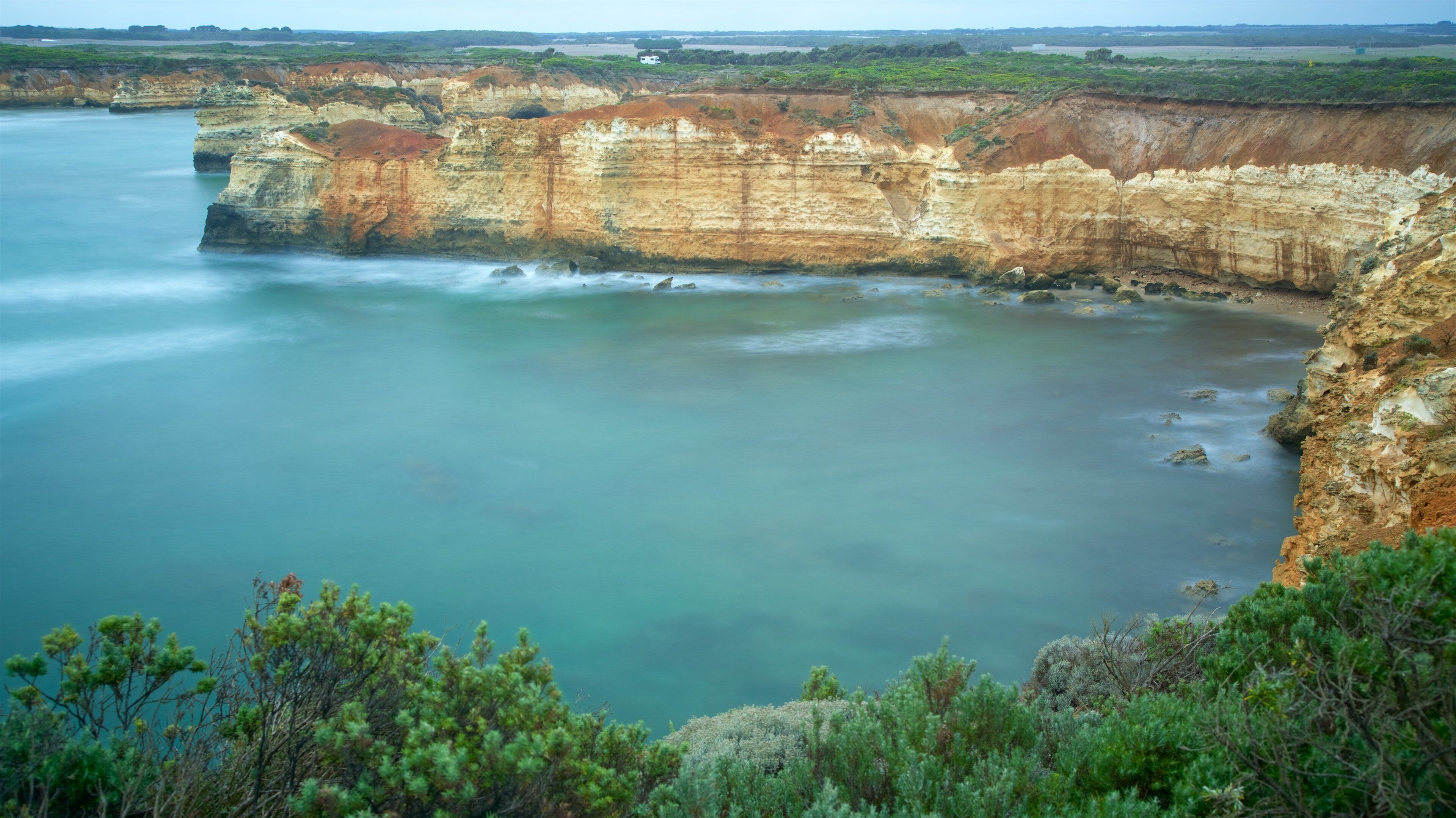 Bay of Islands Coastal Park showing a bay or harbour and rugged coastline