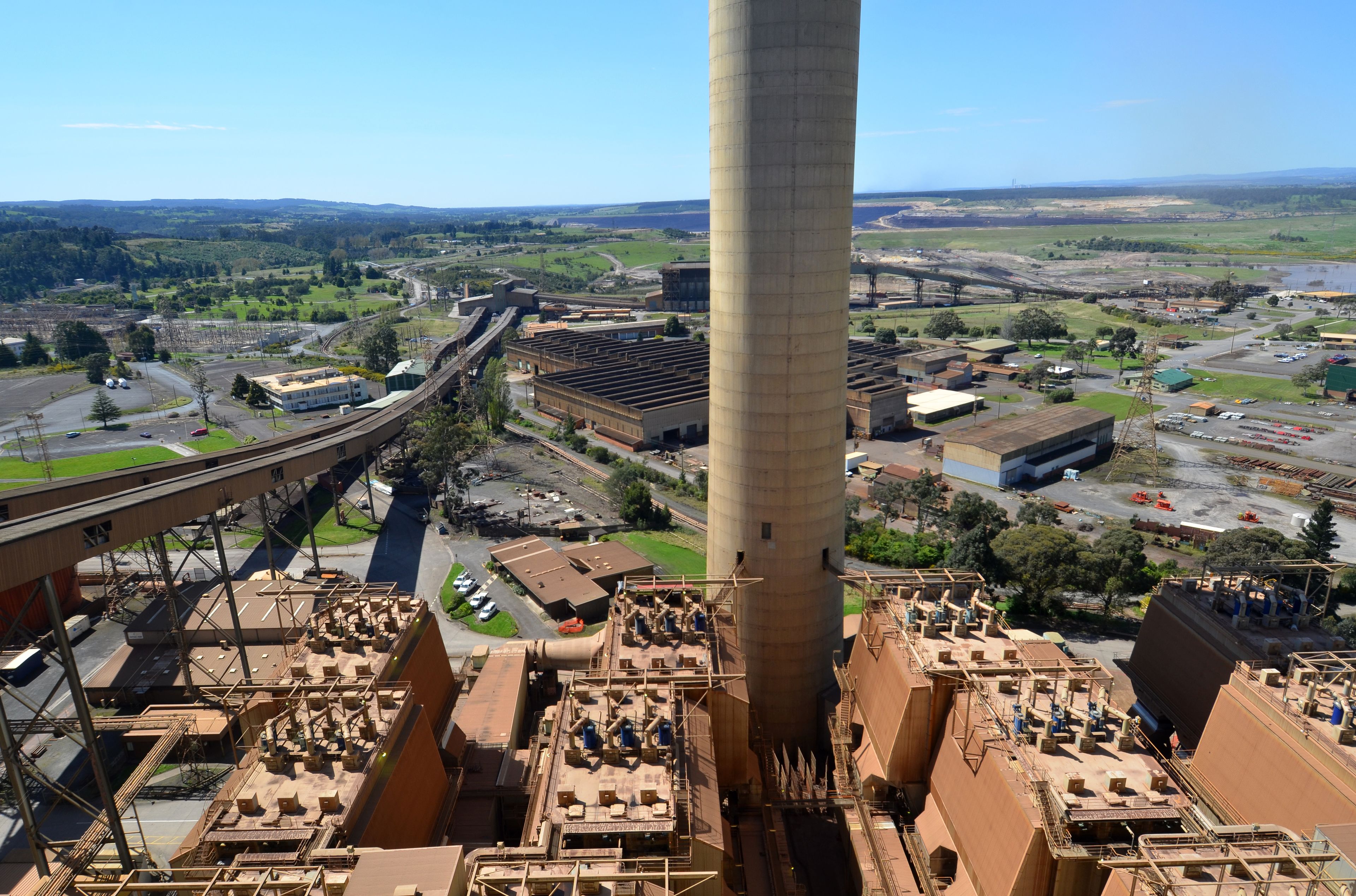 Yallourn W power station in the Latrobe Valley-Gippsland Victoria, high aerial view with opencut in distance and the conveyors that carry the brown coal.