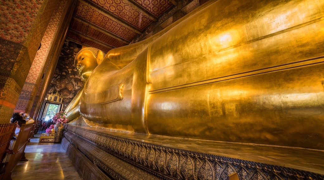 Golden Statue of the Reclining Buddha at Wat Pho Buddhist Temple Complex in the Phra Nakhon District, Bangkok, Thailand. Religious Monument, Tourist Attraction, Travel Destination Concepts.
