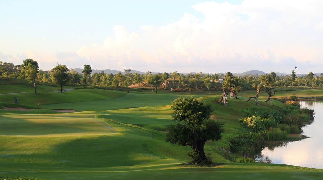 Golf course, lake, sky and green grass,Tropical golf course at sunset, Thailand