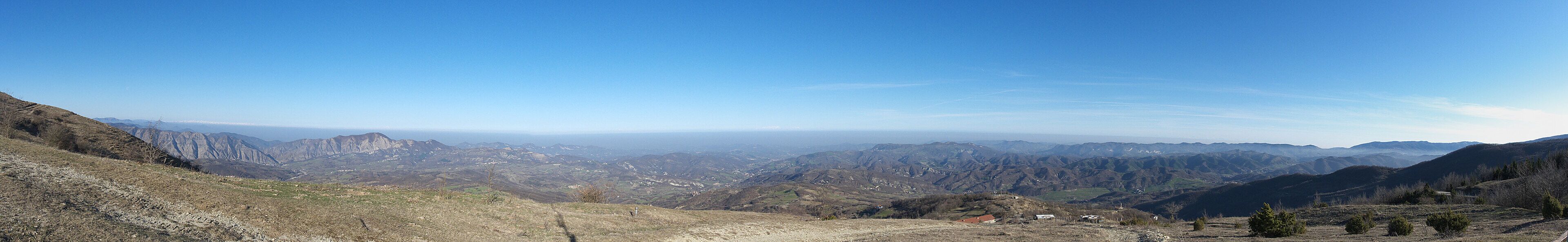 A mountainous landscape with a clear sky.