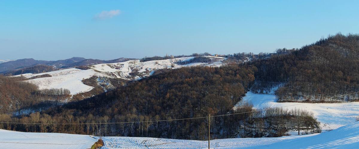 A snow-covered mountain landscape with a clear sky.