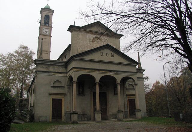 A historic building with a clock tower and the word "DOM" on the facade.