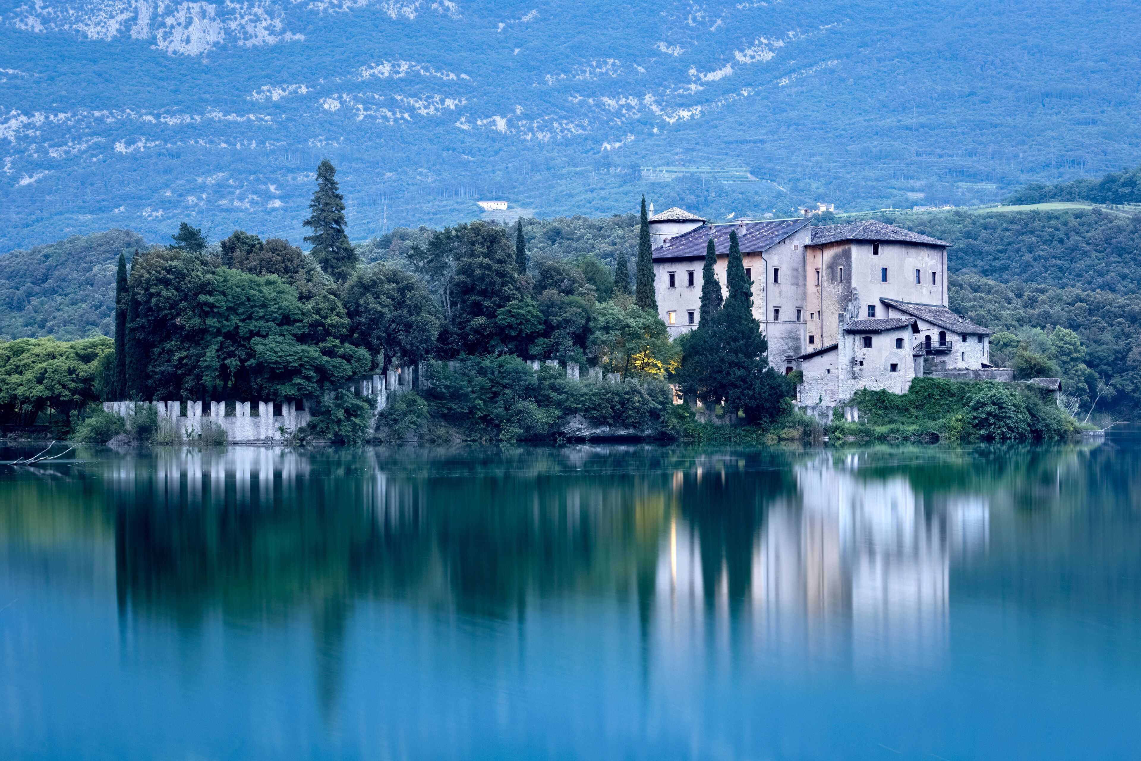 The medieval Stenico castle in the middle of the lake Toblino. Madruzzo, Trentino, Italy.