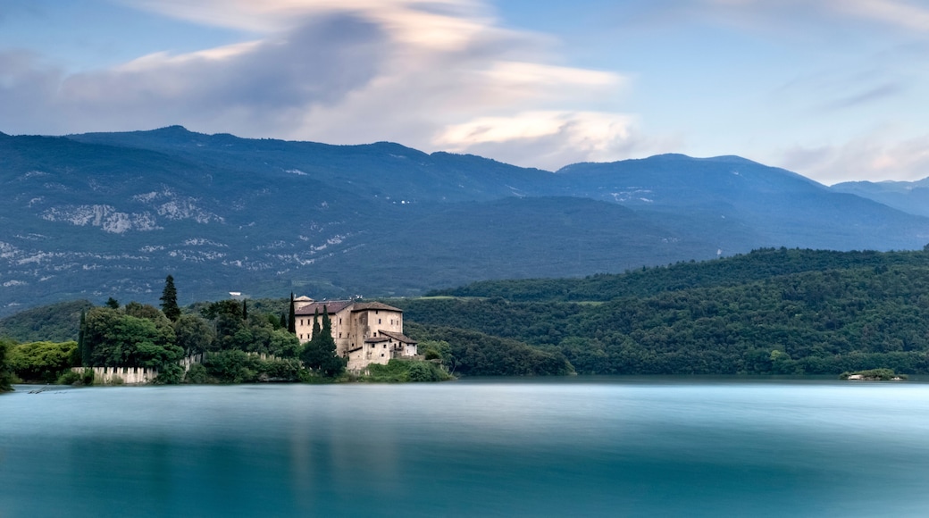 The medieval Stenico castle in the middle of the lake Toblino. Madruzzo, Trentino, Italy.